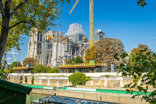 Paris, France - September 10, 2023 : Scaffoldings and cranes of Notre Dame cathedral under renovation