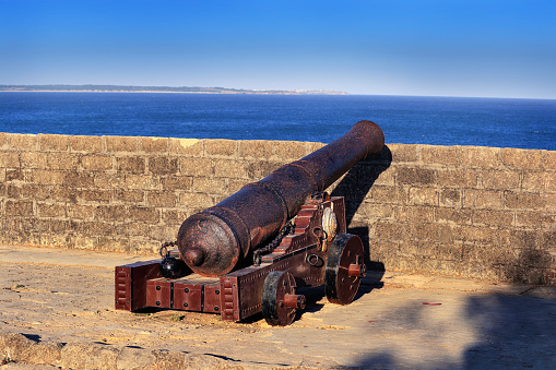 This famous tourist landmarks overlooks the sea. beautiful blue sky and amazing sea view in fort diu. Guns Guarding historical vintage fort. built by Portuguese, located in Daman and Diu, India