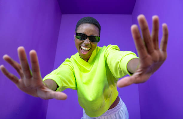 istock Young black woman doing frame using hands and fingers, isolated over purple background. 2147537093