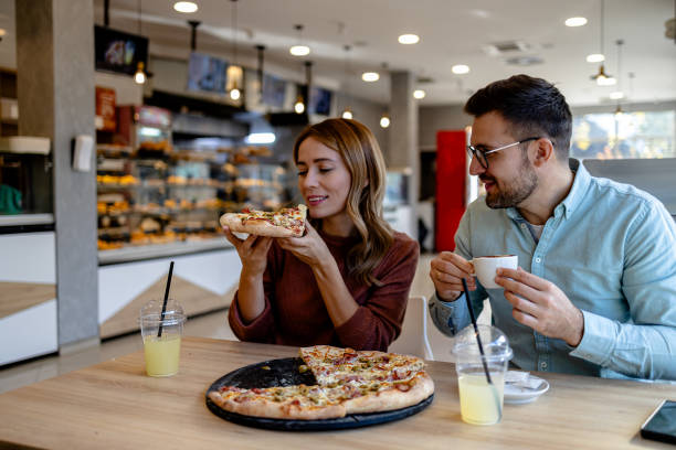 istock Couple enjoying pizza together 2147538025