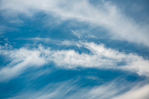 Photograph of prominent clouds in a blue sky in sunlight, taken with a polarizing filter