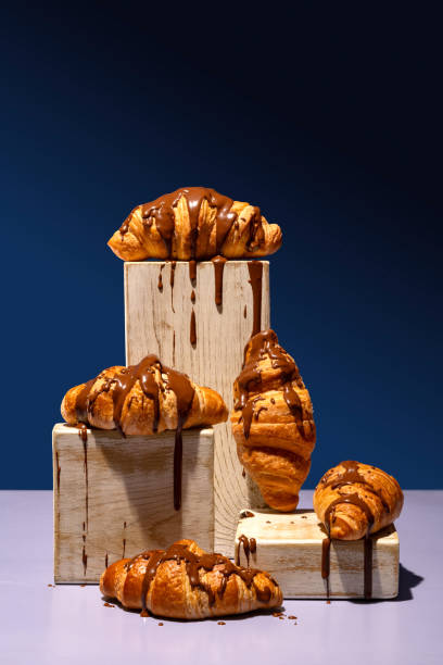 istock Chocolate-covered croissant in a styled pyramid display 2147541844