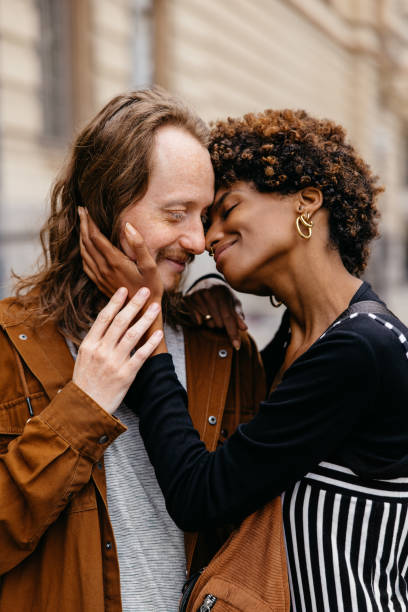 istock Affectionate embrace on a cozy city street 2147543135