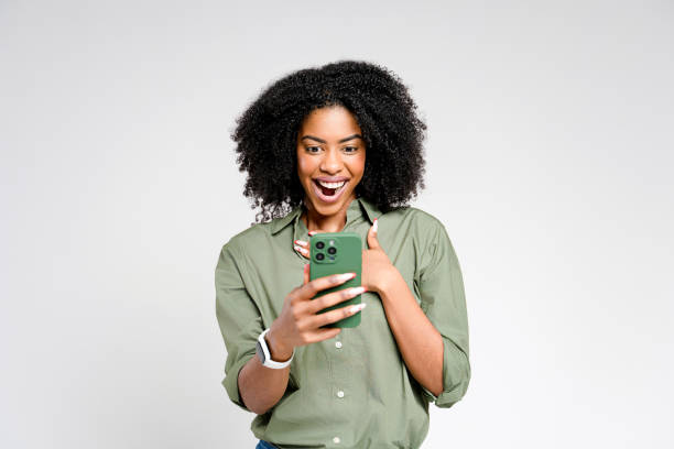 An African-American woman enjoys a moment on her smartphone