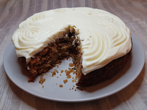 Cross section of a carrot cake with cream cheese frosting, Glasgow Scotland England