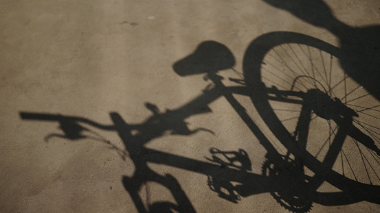 Shadow of man beginning to bike.