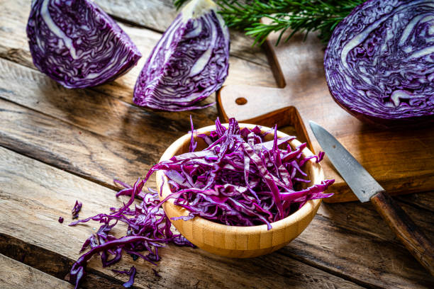 Fresh organic chopped red cabbage in a wooden bowl