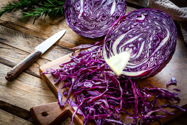istock Fresh organic shredded red    cabbage on cutting board 2147544640