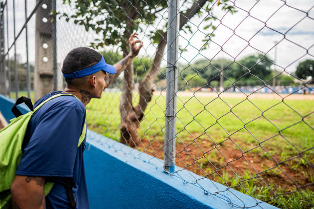 Young man looking for sport filed