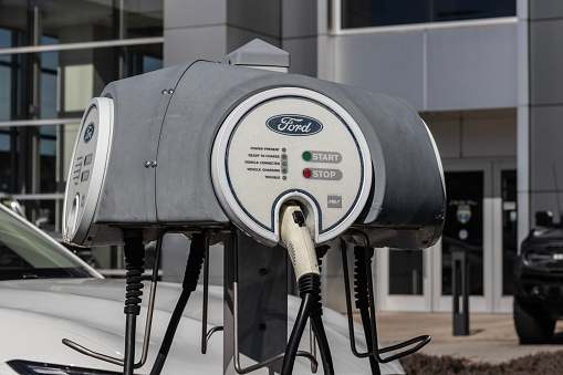 Chicago - April 6, 2024: Ford Electric charging station for the Mustang Mach-E, Maverick Plug-In Hybrid and the F-150 Lightning.