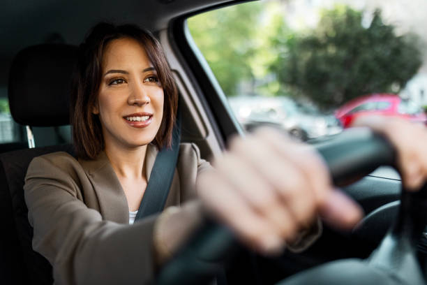 istock Woman Navigating Her Car on the Way to Work 2147544799