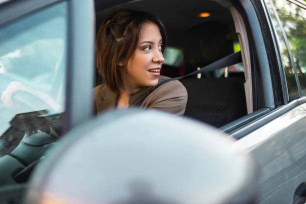 istock Woman Driving to Work in Car 2147544804