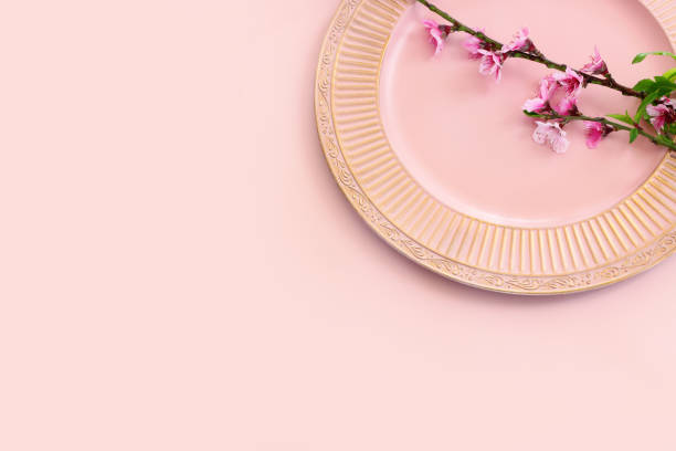 istock image of spring white cherry blossoms tree over pink pastel background 2147545141