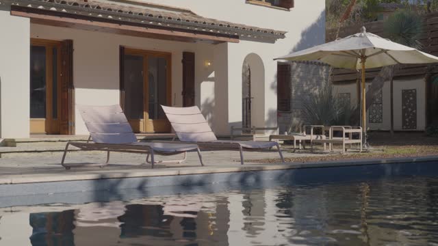 Poolside loungers at a villa retreat