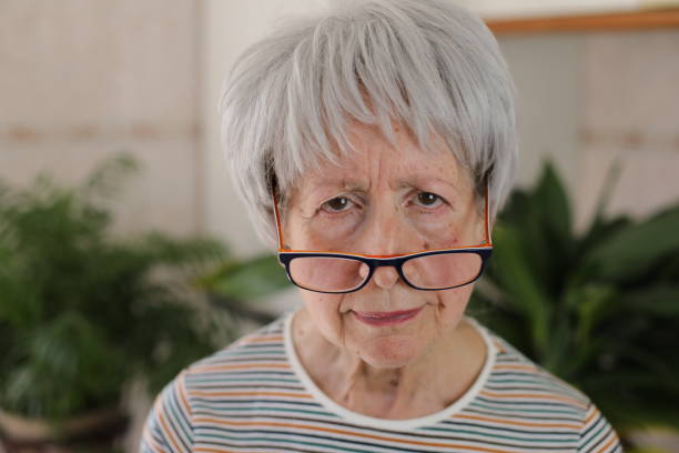 istock Senior woman squinting her eyes 2147547449