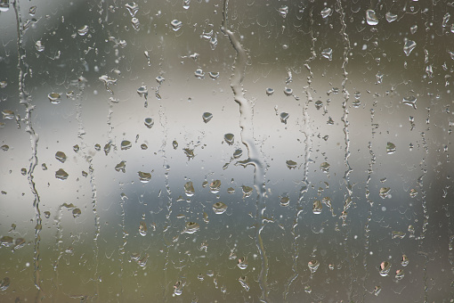 Rain Droplets Running Down Glass