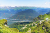 defocused blurred view ofrope suspension bridge over caucasus mountains. No people