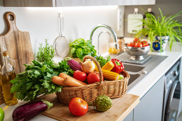 istock Basket full of fresh vegetables on kitchen counter 2147550644