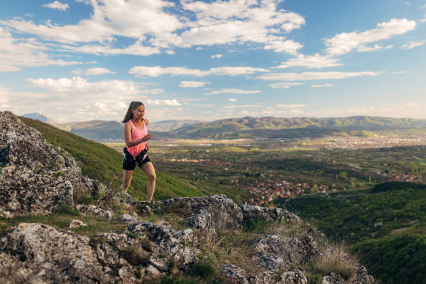 Athlete running on the mountain. Her persistence and courage make her inspiring, because she is not afraid of challenges but actively seeks them in order to test her limits and conquer new heights