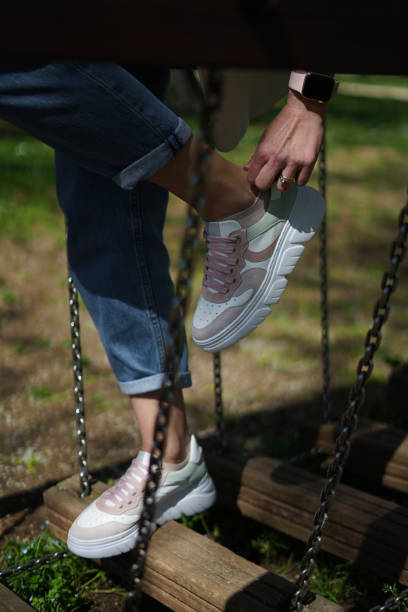 istock Girl adjusting her shoes 2147551829