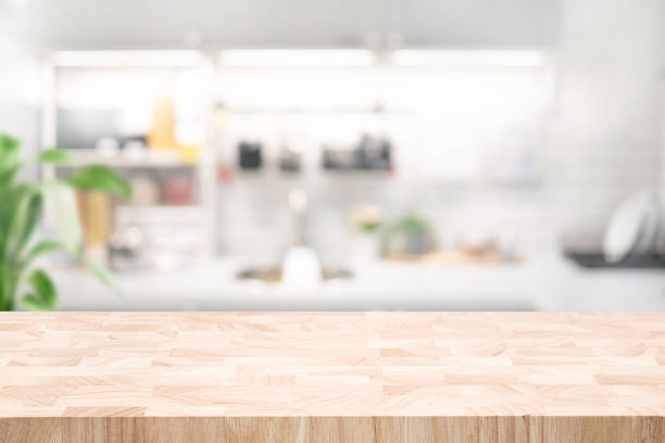 istock Selective focus.End grain wood counter,table top on blur kitchen counter in morning background. 2147552524