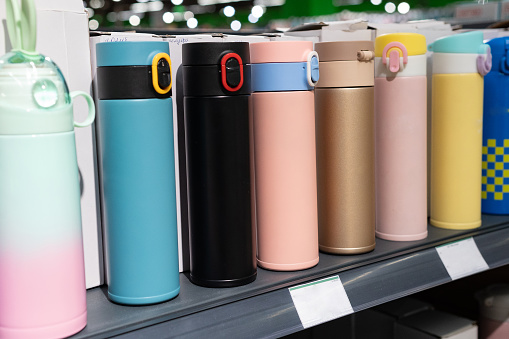 Colored thermos in the shop window
