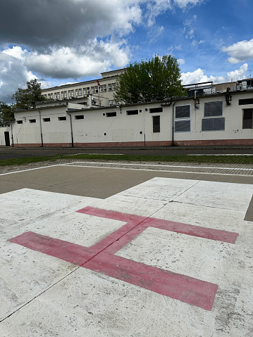 Helicopter landing sign at the parking lot of the hospital building