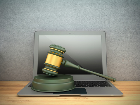 Legal Gavel with Computer Laptop - Colored Background - 3D Rendering