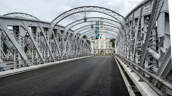 Singapore,7 April 2024: Anderson Bridge spans Singapore River in view captured from bridge itself. photo showcases elegant architecture, offering glimpse cityscape and river life