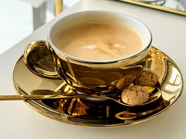 A cup of coffee and biscuits