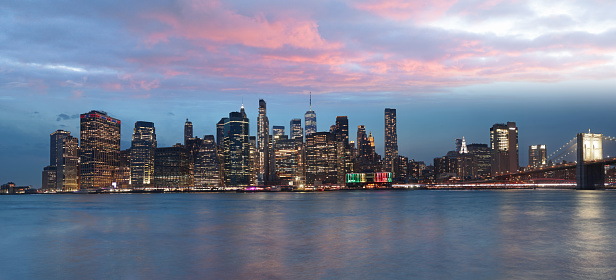 Manhattan Panoramic of downtown financial district, Lower Manhattan and Brooklyn Bridge over Manhattan Bay