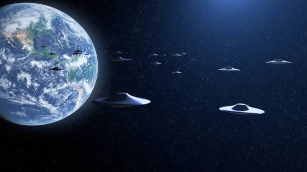 istock Armada fleet of Flying saucer UFO's heading planet earth, outer space view 2147567649