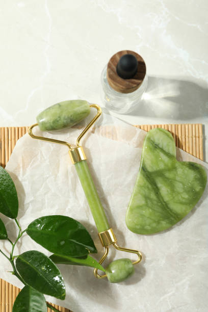 istock Face care concept with gua sha, face roller and cosmetic 2147568720