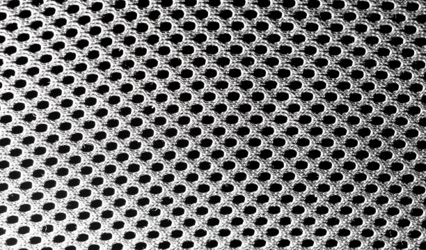 istock Black fabric in a hole as an abstract background. Texture 2147572640