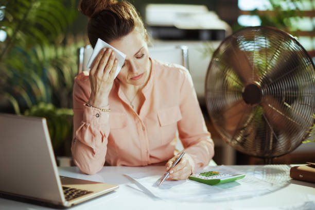 istock modern woman employee at work suffering from summer heat 2147573141