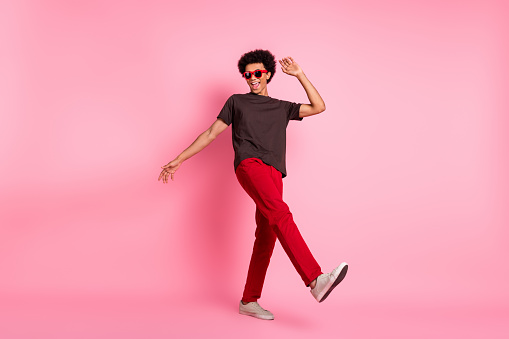 Full length size photo of boogie woogie young student guy chill out in night club crazy atmosphere isolated on pink color background.