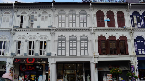 Kuala Lumpur, Malaysia - January 9th 2024:  Old and new architecture combining modern high rise architecture with buildings from the colonial time in the Malaysian capital