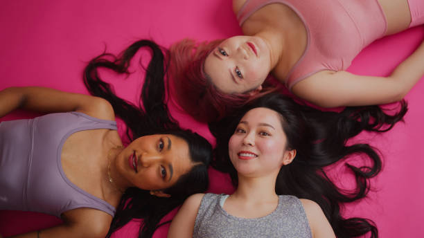 istock Diverse fashion models working and posing for camera in studio environment 2147578518