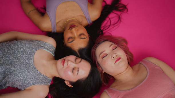istock Diverse fashion models working and posing for camera in studio environment 2147578671