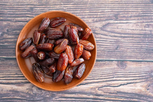 istock dried dates in bowl ready to serve 2147579924