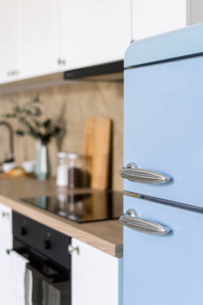 istock Selective focus on blue refrigerator in retro style in modern kitchen 2147581955