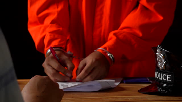 Defendant or Prison Signing and Making a Finger Print on Contract or Legal Document Form.