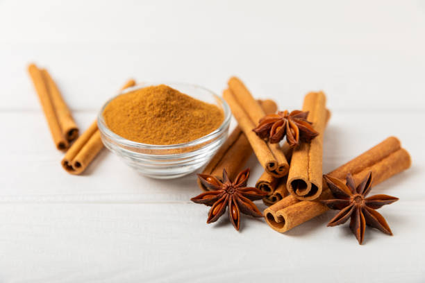 istock Cinnamon sticks and anise on a textured background. Cinnamon roll and star anise. Spicy spice for baking, desserts and drinks. Fragrant ground cinnamon.Place for text. copy space. 2147582995