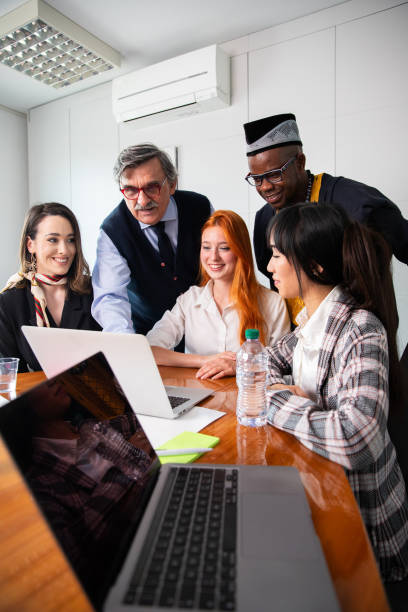 istock Business meeting between business partners, multi ethnic group with different ages, vertical photo 2147583617