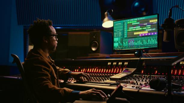 istock African american sound designer working with editing software to produce tracks 2147584195