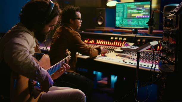 istock Talented guitarist doing live performance in professional studio 2147584884