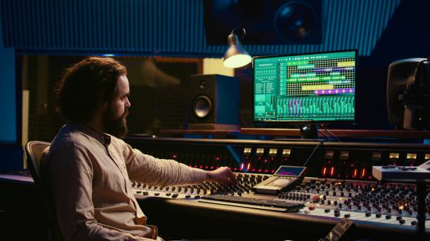 istock Tracking engineer used audio mixer in professional recording studio 2147584978