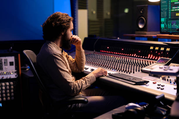 istock Sound designer mixing and mastering music in recording studio 2147585114