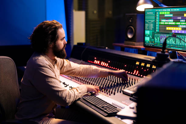 istock Mixing engineer working on blending individual tunes of a recording 2147585763
