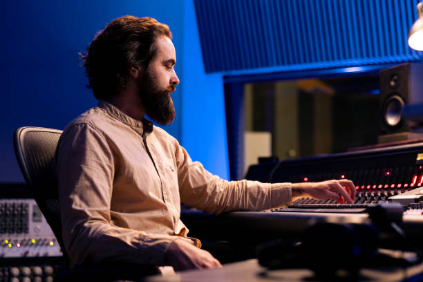 istock Sound expert working on recording and composing new tracks 2147585817